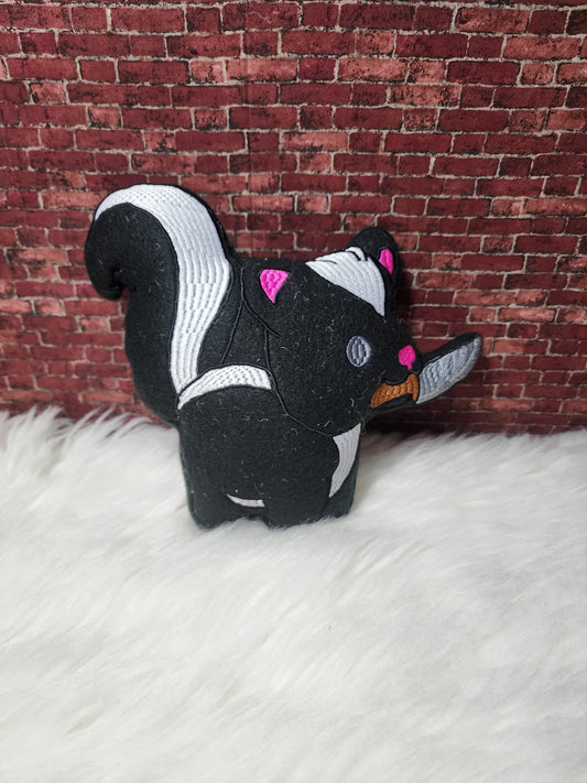 Skunk with knife plushie